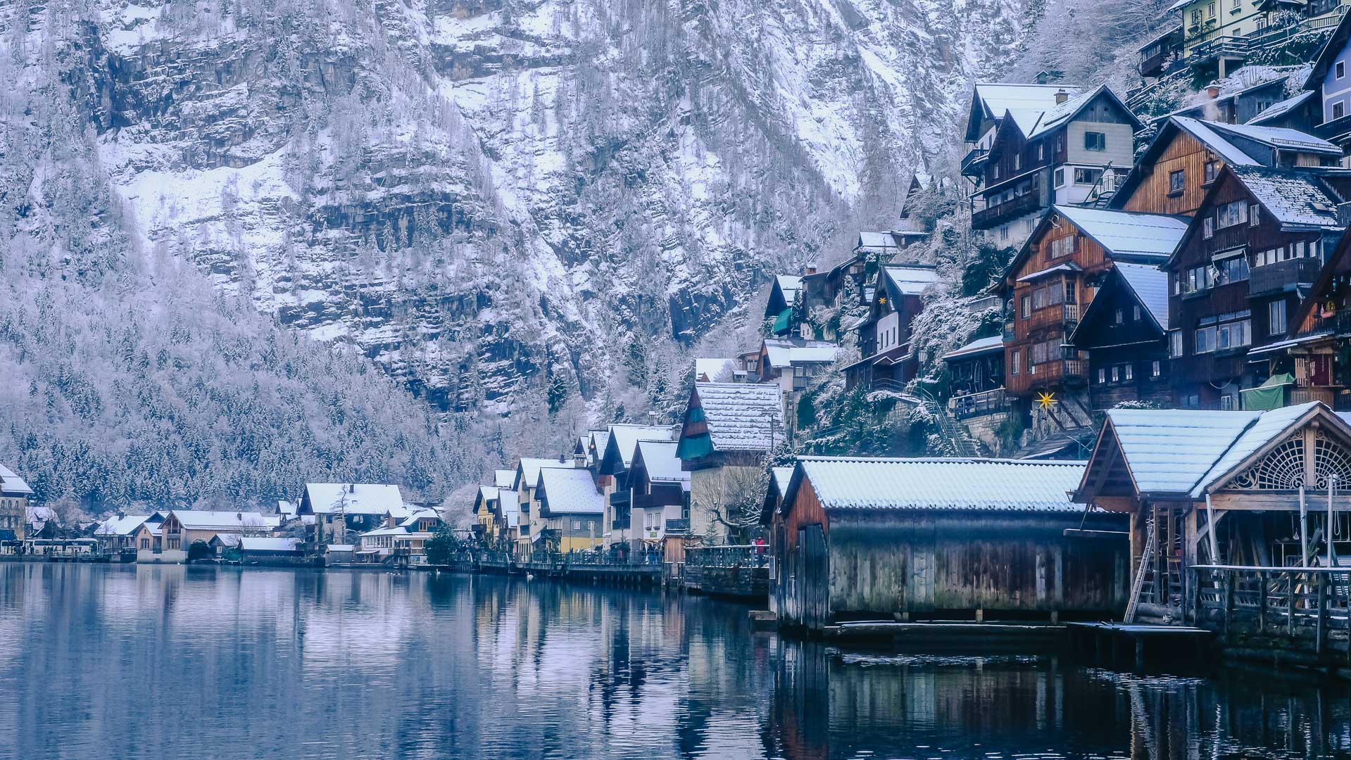 Hallstatt in Winter The Houses on the side of the Lake in Hallstatt with snow on the roofs
