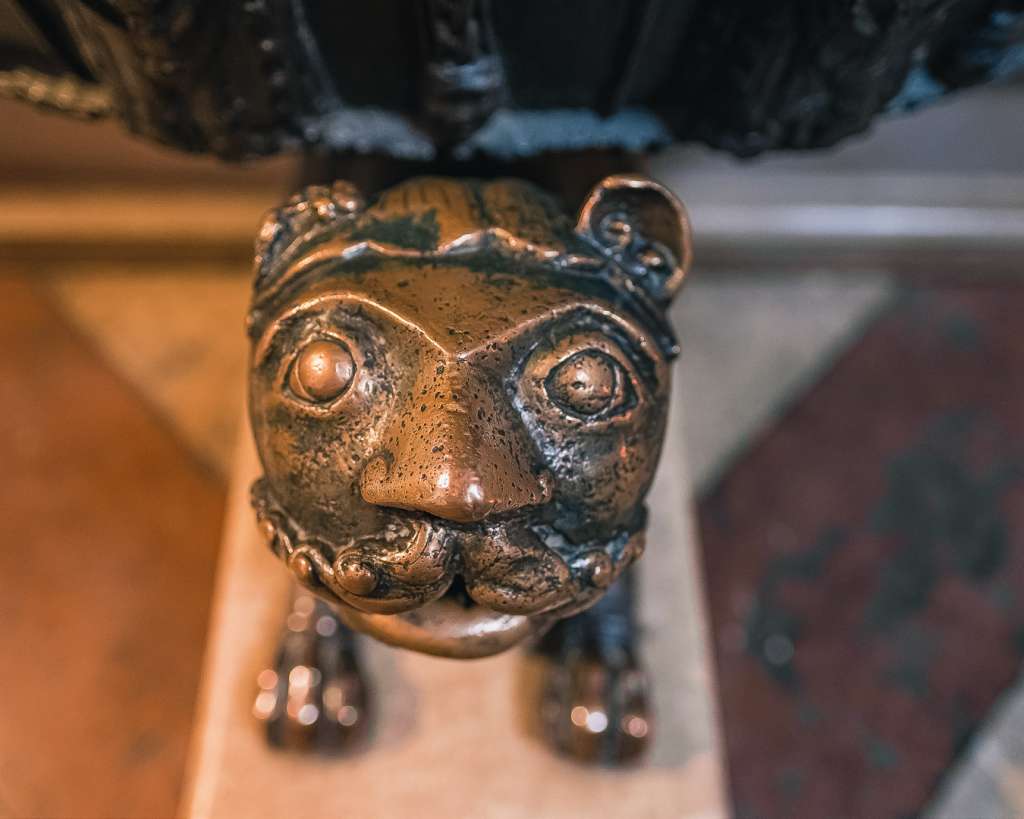 Romanesque Lion at the baptismal font in the Salzburg Cathedral